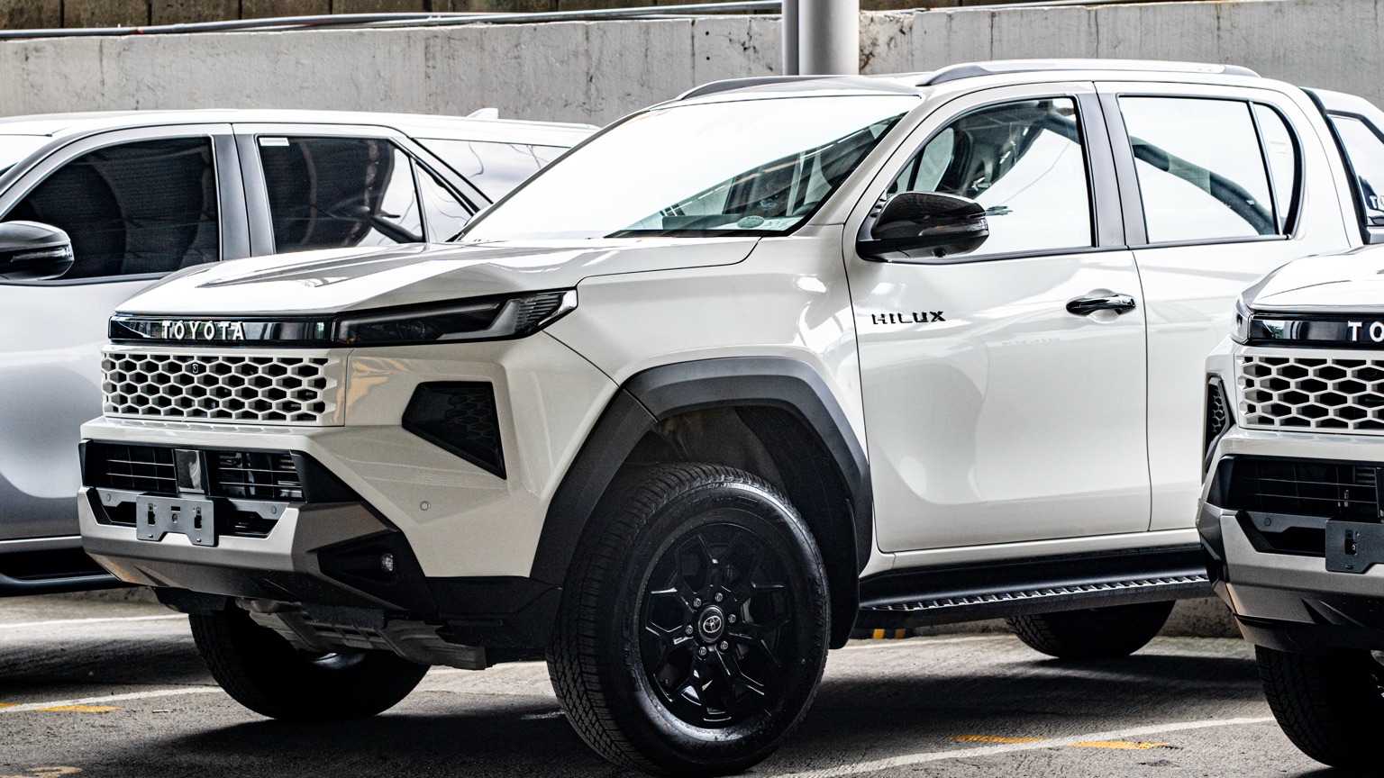 A brand-new Toyota Hilux Conquest at the Sovereign Motors holding yard