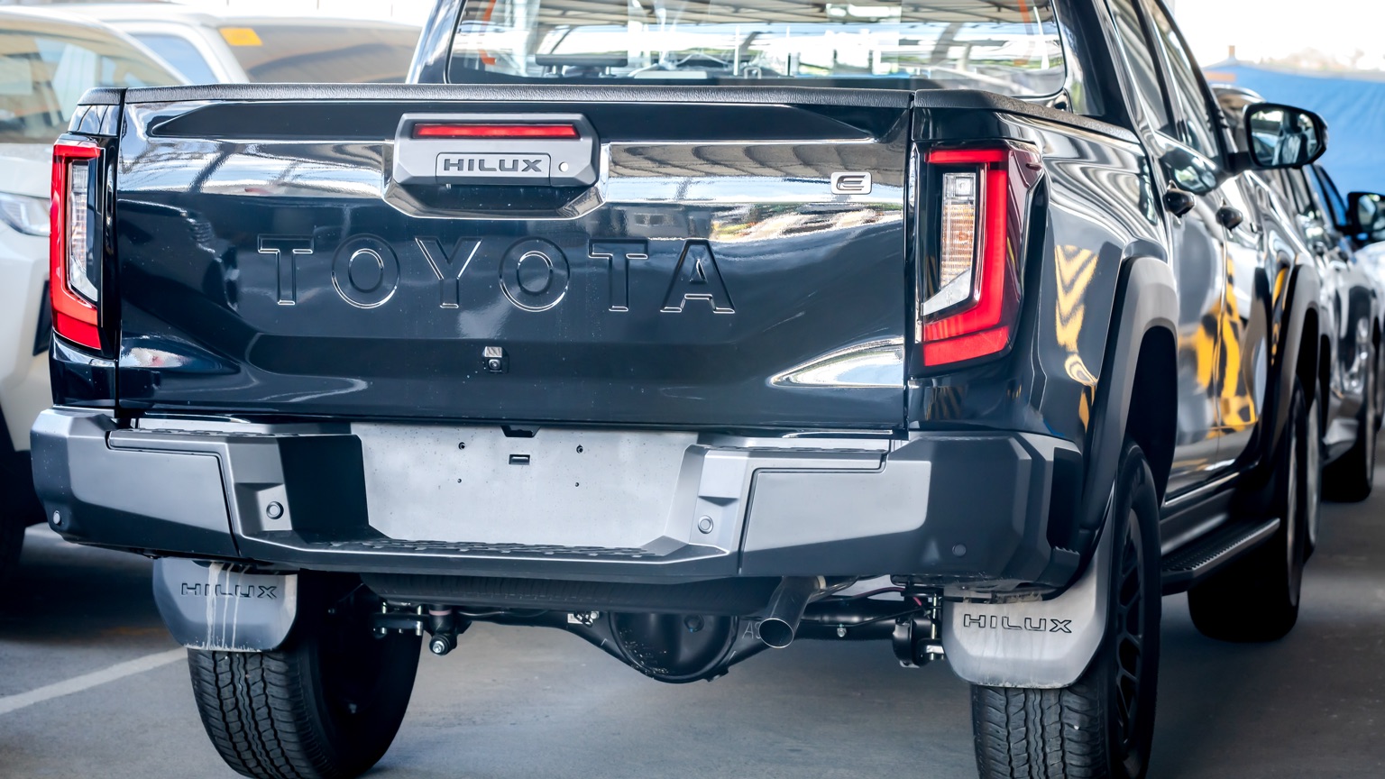 Rear of a Toyota Hilux E showing the tailgate and bumper step