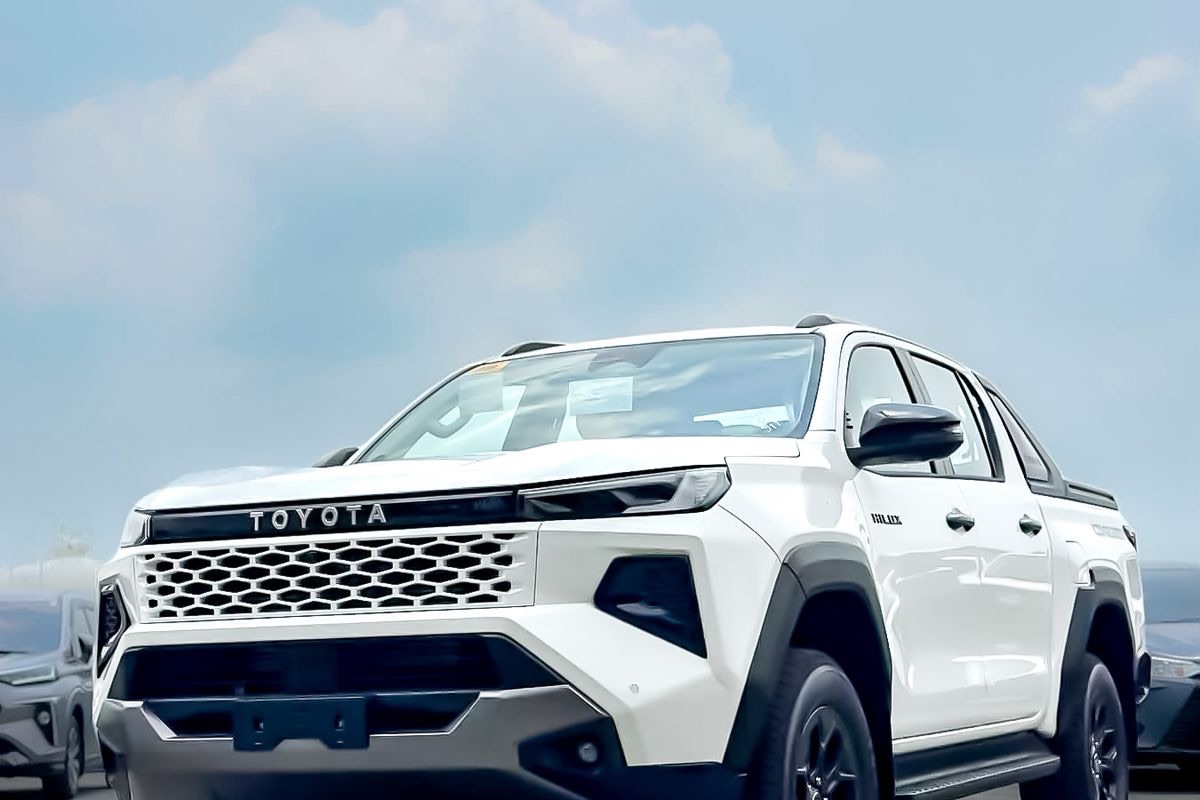 A brand-new white Toyota Hilux at the holding yard